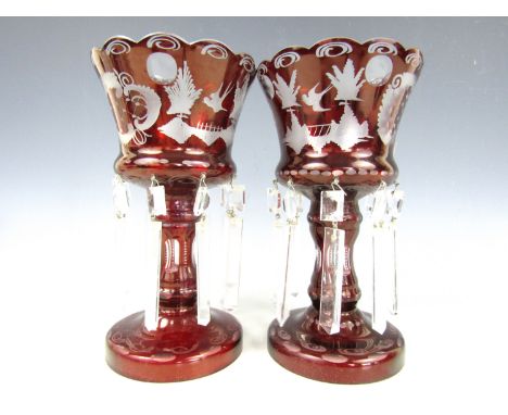 A pair of ruby flashed and cut glass lustres, 22 cm  