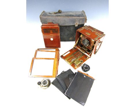 An early 20th Century 'The Sanderson' Tropical model quarter plate camera retailed by Robinson & Co of Singapore, of brass mo