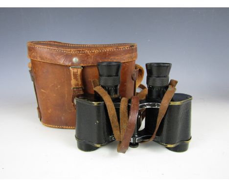 A pair of First World War British Army prismatic binoculars, Ordnance marked and in original leather case, the latter bearing