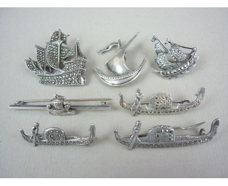 Vintage white metal and continental white metal marcasite brooches in the form of boats, including a sailing ship and a bar b