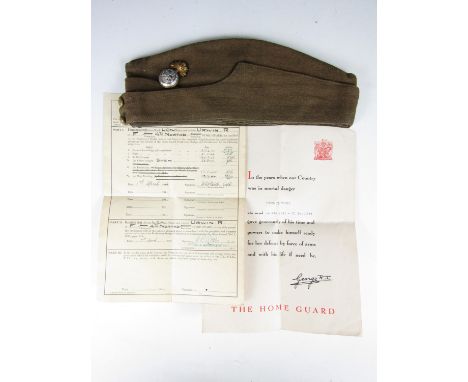 A Second World War Northumberland Home Guard group comprising Field Service Cap bearing the name of R Urwin, and the latter's