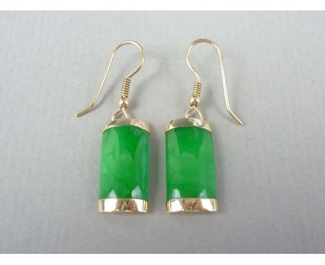 A pair of contemporary jade and yellow metal pendant earrings, of convex rectangular form