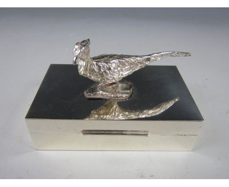 A late 20th Century Italian electroplate cigarette or trinket box with pheasant-form surmount, opening to revel a plush lined
