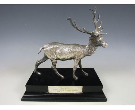 An Elizabeth II silver model of a stag, on an ebonized plinth bearing engraved presentation plaque, C J Vander Ltd, Sheffield