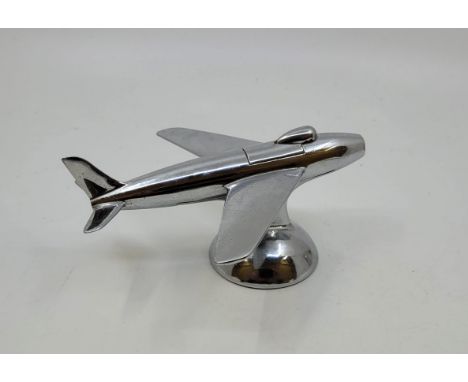 A Dunhill novelty chrome plated table cigarette lighter modelled as an aeroplane, Reg. Design No. 872899, length 16cm.&nbsp;&