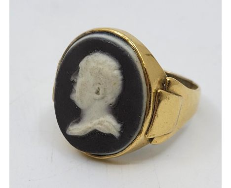 A George III precious yellow Wedgwood & Bentley dark blue jasperware cameo ring, late 18th century, the medallion with a a bu