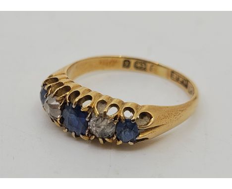 A Victorian 18ct. gold, sapphire and diamond five stone ring,&nbsp;Birmingham 1897, set three graduated mixed cut sapphires a