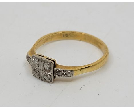 An Art Deco style 18ct. gold and diamond ring, having square mount to centre set four eight-cut diamonds with each shoulder s