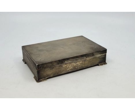 An engine turned rectangular silver cigarette box, by S J Rose &amp; Son, Birmingham 1961, cedar lined (at fault), length 16.