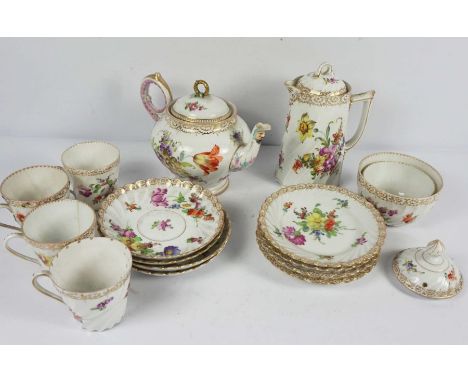 A Dresden porcelain part tea service, 19th century, decorated with flowers on a white ground, all with fluted twist bodies, c