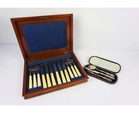A cased set of six pairs of silver bladed fish eaters, Sheffield 1882, together with a Victorian cased silver set of a knife,