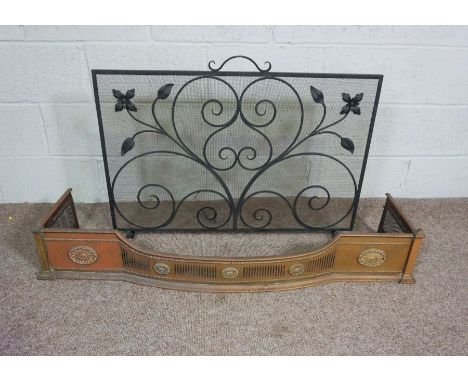 A 19th century brass fire curb, with pierced decoration, 126cm wide, and a wrought iron firescreen (2)