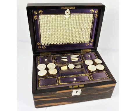 An early Victorian coromandel sewing box, circa 1840, the case opening to reveal a fitted interior, including mother of pear 
