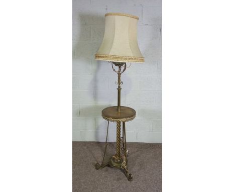 An unusual Victorian &nbsp;brass and stoneware standard lamp stand, the decorative stoneware oil reservoir (possibly by Doult