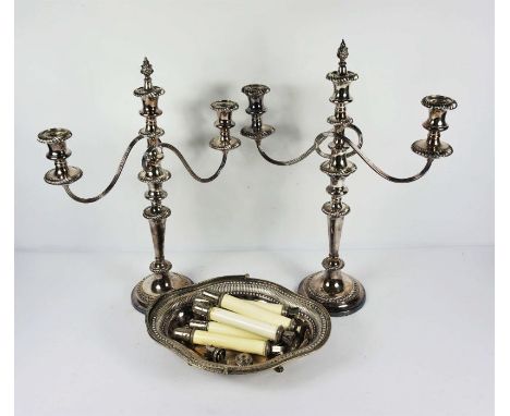 A large and good pair of George III style silver plated three light candleabra, with gadrooned decoration and knopped tapered