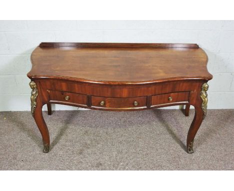 A Louis XVI style mahogany veneeered console table, 20th century reproduction, with serpentine top over three frieze drawers 