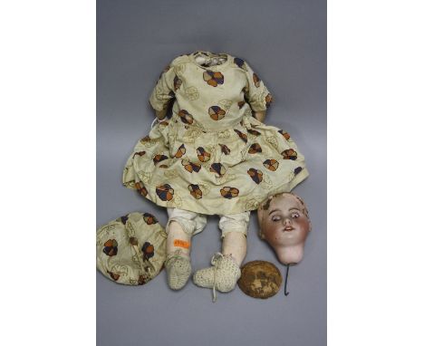 AN S.F.B.J. BISQUE HEAD DOLL, nape of neck marked S.F.B.J. 60 Paris - 1 1/4-', sleeping eyes, open mouth showing four teeth, 