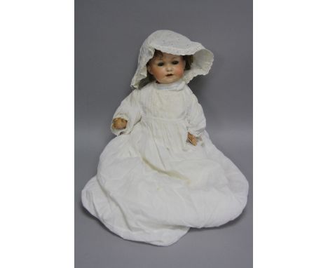 A BISQUE HEAD DOLL, nape of neck marked 'Germany 971 A CM D.R.G.M. 267', with two holes in back of neck, sleeping eyes, open 