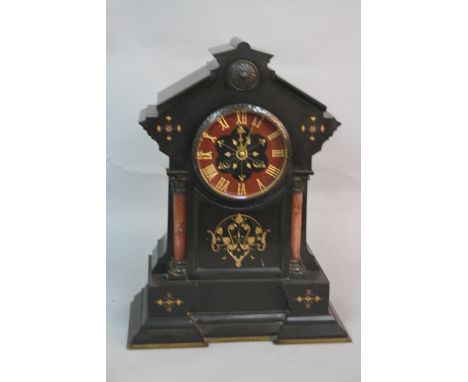 A LATE 19TH CENTURY BLACK SLATE MANTEL CLOCK, of architectural form, the marble and slate dial with gilt Roman numerals, bell