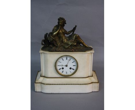 A MID 19TH CENTURY WHITE MARBLE MANTEL CLOCK, the case surmounted by a gilt metal figure of a classical female reclining agai