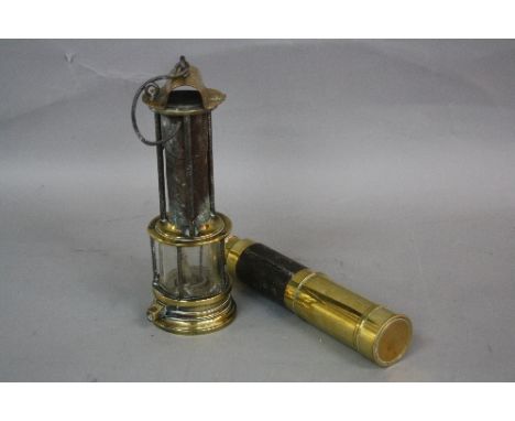 A 19TH CENTURY BRASS CLANNY TYPE MINER'S LAMP, stamped on the arched hood with ECC in a triangle, height approximately 26.5cm
