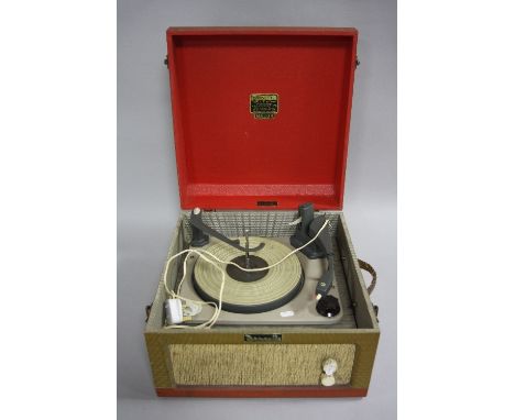 A DANSETTE MAJOR RECORD PLAYER, finished in mock wicker tolex with red lid and base, two controls to the front panel over a h