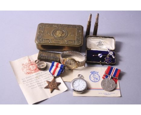 A 1914 PRINCESS MARY TIN, containing an original greeting slip, two bullet pencils, a small escape type compass, a Trench Art