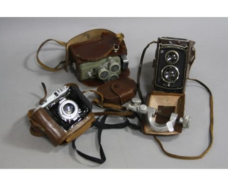 A ROLLEICORD TLR CAMERA, in leather case, lens Serial No.1756990, a Eumig Electric R Cine camera in leather case, a Daiichi K