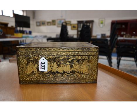 AN EARLY 19TH CENTURY RECTANGULAR JAPANNED TEA CADDY, the exterior decorated with gilt figures and landscapes, the interior f