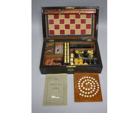 AN EXOTIC HARDWOOD GAMES COMPENDIUM, marked W.M. Gatty to lock escutcheon (no key), fitted interior holding chess set, draugh