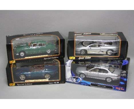 FOUR BOXED DIECAST MAISTO JAGUAR CAR MODELS, XJ220, XK180, X-Type and 1959 MKII, all 1:18 scale