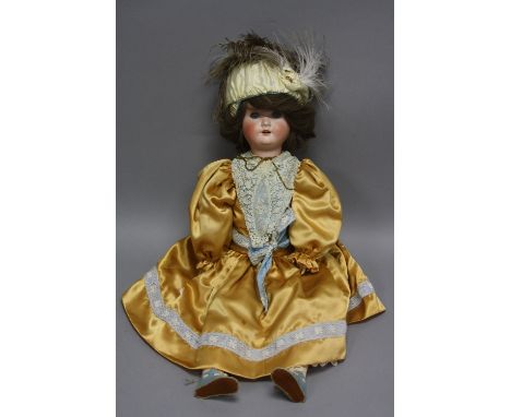 A SCHOENAU & HOFFMEISTER BISQUE HEAD DOLL, nape of neck marked with the star logo and '1909 5 1/2 Germany' and with the two h