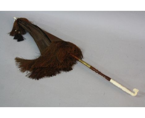 A LATE VICTORIAN BROWN SILK PARASOL, with ivory fittings to handle and finial, folding handle