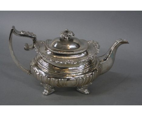 A 19TH CENTURY WHITE METAL TEAPOT, of shaped rectangular form, foliate cast finial and rim accanthus leaf to top of angular h