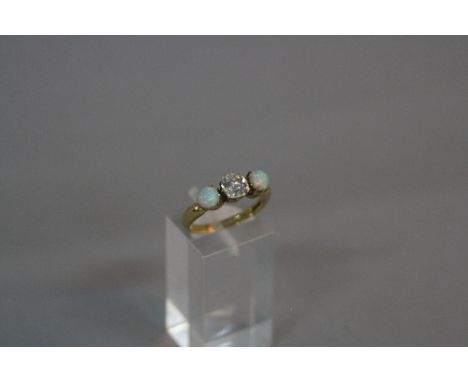 A VICTORIAN 18CT GOLD DIAMOND AND OPAL THREE STONE RING, one cushion old cut diamond, estimated weight 0.90ct, colour assesse