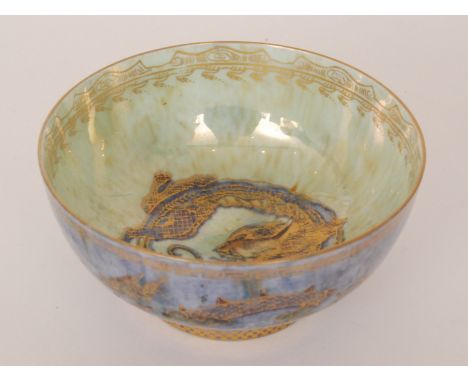 A Wedgwood Lustre bowl decorated to the exterior with gilt and enamel dragons against a mottled blue ground, the interior wit