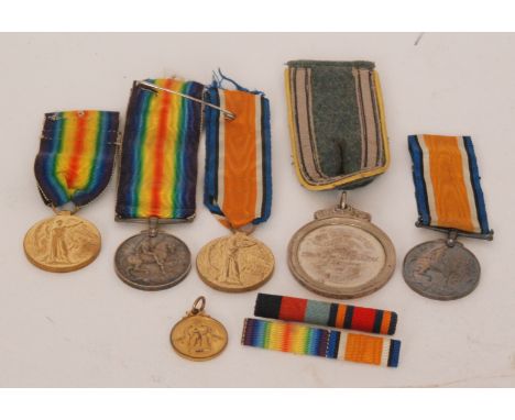 Two First World War medal pairs to 177591 Gnr W. Rogers, R.A and 121345 Pte H. Jones R.A.M.C, together with a silver medallio