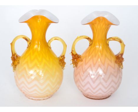 A pair of late 19th Century Stourbridge quilted air trap vases of spherical form with flared and folded rim, cased in a gradu