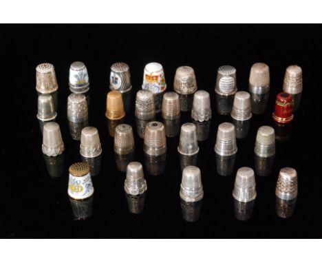 Twenty nine assorted white metal and enamel decorated thimbles to include gilt metal, commemorative and other examples. (29) 