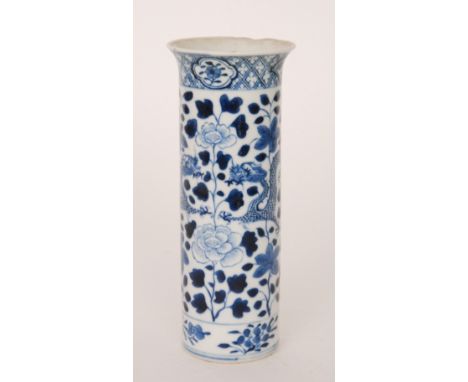 An early 20th Century Chinese blue and white cylinder vase decorated with dragons, peonies and foliage, bears four Kangxi mar