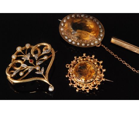 A small parcel lot of brooches to include a Continental 9ct seed pearl, ruby and diamond brooch with scrolling wirework folia