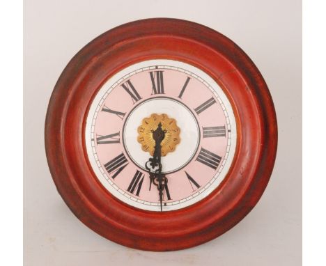 An early 20th Century postman's alarm clock, the pink and white dial with central alarm dial to a stained surround, the dial 