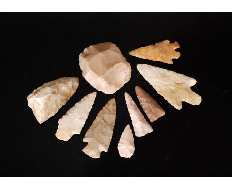 A collection of nine knapped flint arrow heads, together with two flint tools and three small ammonite fossil samples (qty)

