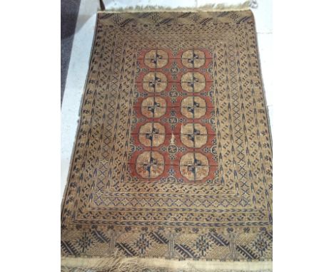 Two early 20th Century Middle Eastern rugs, the first with two rows of five guls upon a red ground within oatmeal and blue bo