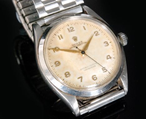 A 1940s gentleman's Rolex Oyster Perpetual wristwatch, the cream dial with outer 1/5th seconds track, applied gold Arabic num