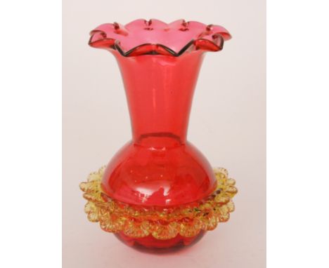 A late 19th Century Thomas Webb ruby vase of globe and shaft form with an applied canary rigger work double ring to the body,