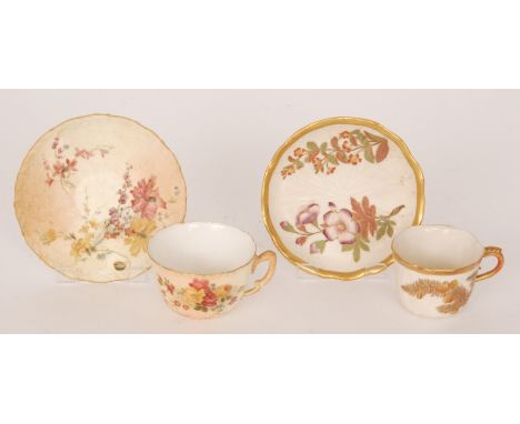 Two Royal Worcester teacups and saucers, the first decorated with floral sprays, dated 1898, the second formed as a waterlily