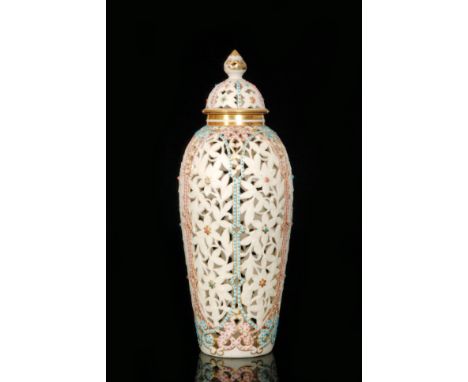 A Grainger & Co, Royal China Works, Worcester reticulated vase and cover, the body with floral panels with jewelled border ed
