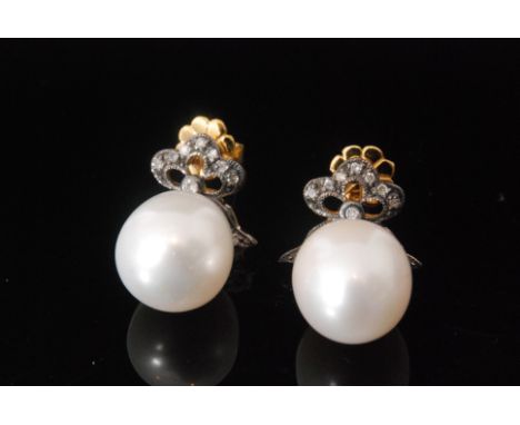 A pair of  Edwardian style silver gilt diamond and freshwater pearl drop earrings, diamond set bow above tear shaped pearl, l