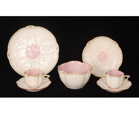 A 19th Century part teaset comprising eleven lobed teacups, eleven saucers, ten side plates, a slop bowl and a cake plate, ea